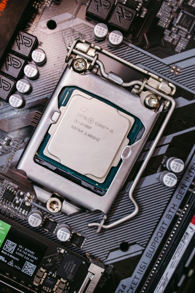 Detailed view of an Intel CPU installed on a motherboard highlighting technological components.